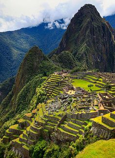 the ruins of machaca picach are surrounded by mountains