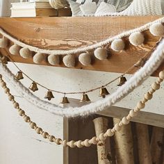 a wooden shelf with some decorations on top of it