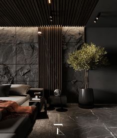 a living room with black walls and marble flooring