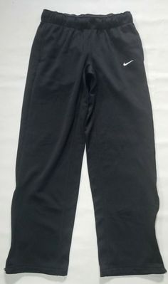 NIKE THERMA-FIT MEN'S ATHLETIC PANTS / SWEATPANTS SIZE: SMALL COLOR: BLACK UP FOR YOUR CONSIDERATION ARE A GREAT PAIR OF NIKE SWEATPANTS.  PANTS ARE IN EXCELLENT OVERALL CONDITION.  PANTS FEATURE HAND POCKETS, ELASTIC WAISTBAND w/ DRAWSTRING, AND ZIP UP OPEN HEM ANKLES. PLEASE SEE ALL PICS AND ASK ANY QUESTIONS PRIOR TO BUYING. THANK YOU FOR VISITING THROWBACK SPORTS APPAREL Nike Boys Track Pants, Nike Black Functional Sweatpants, Functional Black Nike Sweatpants, Nike Go-dry Pants For Jogging, Nike Go-dry Joggers For Jogging, Nike Black Sweatpants For Gym, Nike Moisture-wicking Sweatpants For Gym, Nike Go-dry Jogging Pants, Nike Sweatpants With Go-dry For Sports