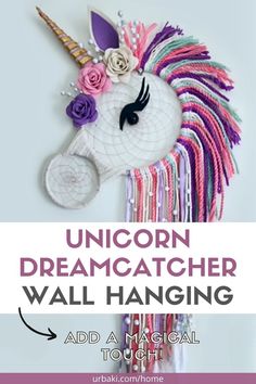 the unicorn dream catcher wall hanging is made out of yarn and plastic beads with flowers on it