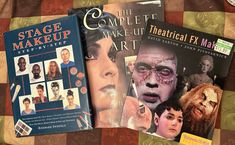 three books about theatre and makeup on a bed