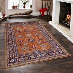 a large red rug in front of a fireplace