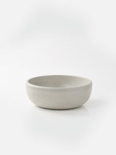 a white bowl sitting on top of a table