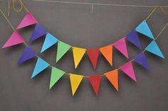 multicolored paper buntings hanging on the wall