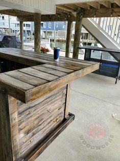 an outdoor bar made out of wooden planks