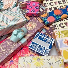 many different types of wrapping paper on top of each other