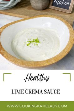 healthy lime crema sauce in a white bowl on a cutting board with text overlay