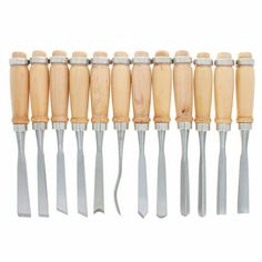 a set of eight wooden carving tools with metal handles and wood handle, all lined up in a row