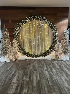 a room decorated for christmas with lights and trees