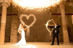 a man and woman in wedding attire holding sparklers with the words persian party song mix