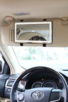 the interior of a car with its lights on