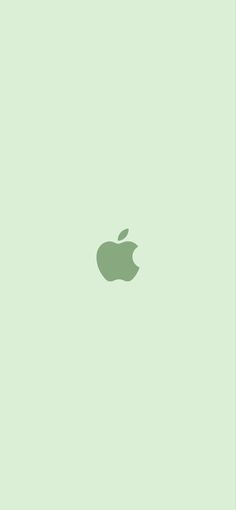 an apple logo on a light green wallpaper with space for your text or image