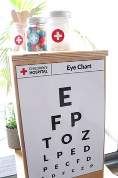 an eye chart is displayed on a wooden stand