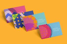 four business cards with different designs on them