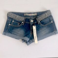 Dollhouse Jean The Sienna Rhinestone Embellished Distressed Shorts Size 3 Nwt The Chic And Trendy Blue Denim Shorts Feature Fading To Front And Rear. Crumpled Front Thigh Whiskers. Raw Edge, Frayed Cuff/Leg Opening. Rhinestone Embellished Front Waistband. Stretchy Fabric For A Comfortable Fit. Size 3 Fabric 63% Cotton 24% Polyester 7% Rayon 1% Spandex Trendy Embellished Jean Shorts, Blue Rhinestone Embellished Shorts, Blue Rhinestone Shorts, Jean Short Overalls, Mid Rise Jean Shorts, White Distressed Jeans, Boho Jeans, Ripped Jean Shorts, Destroyed Denim