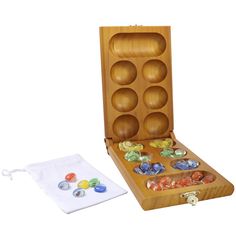 a wooden box filled with lots of different types of buttons in it's compartments