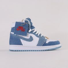 Debuted in 1985, the Air Jordan 1 Denim High Top offers a rendition to the iconic classic. Released September 22nd, 2022.* Gold bamboo hoop earrings on laces * White leather upper with stone wash denim overlays * White patched wings logo on the side * Denim and white colourway Size and Fit* Fits true to size Air Jordan 1 Denim, Jordan 1 Denim, Jordan Aesthetic, High Top Air Jordans, Jordans Aesthetic, Shoe Custom, Pretty Sneakers, Bamboo Hoop Earrings, Nike High Tops