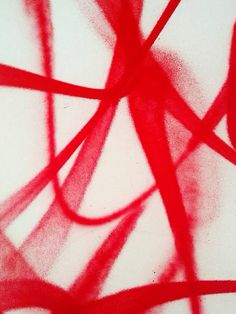 an abstract painting with red lines on it