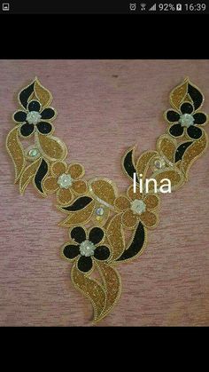 an image of a necklace with flowers on it and the word luna written in white