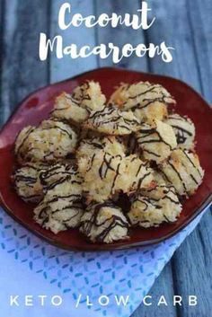 coconut macaroons on a red plate with chocolate drizzle