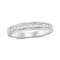 a white gold ring with baguetts of diamonds