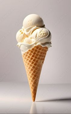 an ice cream cone with three scoops on it's side, in front of a gray background