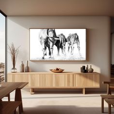 two horses are standing in the middle of a room with a table and chairs next to it