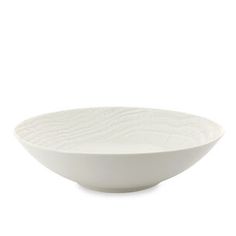 a white bowl sitting on top of a table