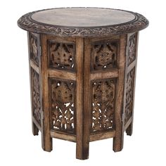 an ornate wooden table with carvings on it