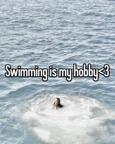 someone is swimming in the water with their head above the water and text saying swimming is my hobby