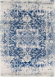 a blue and white rug with an intricate design