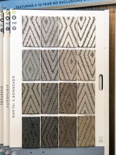 a bunch of carpet samples on display in a store