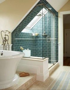 a bathroom with a skylight above it and a bathtub in the middle of the room