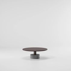 a round table sitting on top of a white floor