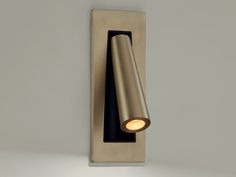 a wall light that is on the side of a wall with a small light in it