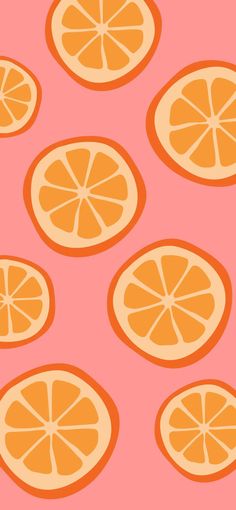 orange slices are arranged on a pink background