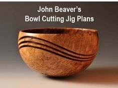 a wooden bowl sitting on top of a table next to the words john beaver's bowl cutting jig plans