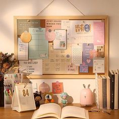 an open book sitting on top of a wooden desk