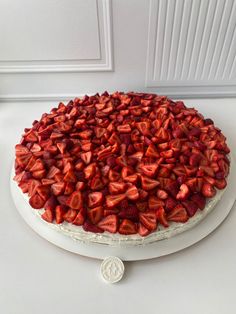 there is a cake with strawberries on it