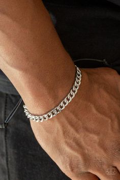 Shiny black cording knots around the ends of a silver beveled curb chain that is wrapped across the top of the wrist for a versatile look. Features an adjustable sliding knot closure. Sold as one individual bracelet. Adjustable Knot Bracelet, Guy Jewelry, Adjustable Sliding Knot, Sliding Knot Closure, Mens Chain Bracelet, Mens Silver Jewelry, Mens Bracelet Silver, Mens Jewelry Necklace, Hand Bracelet