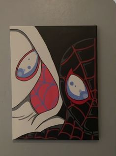 the painting is hanging on the wall in front of the door and it looks like spider - man