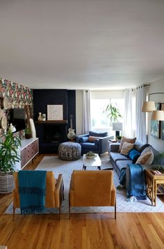 a living room filled with furniture and a fire place