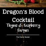 the dragon's blood cocktail is served with raspberries