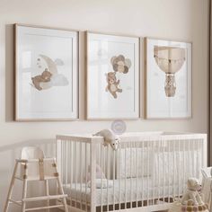 a baby's room with three framed pictures on the wall