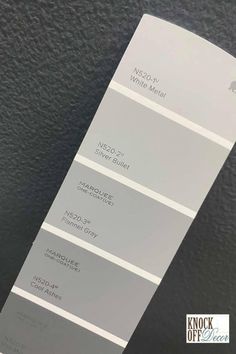 a white and gray paint swatch with the words neo - neutral on each side