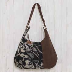 From Thai designer Sansanee Krasae this eye-catching cotton handbag features a floral print inset. In tones of silver deep black and rich brown it opens to reveal a zipper pocket and two open compartments. The zipper pull is adorned with a leather flower. Cheap Bohemian Brown Shoulder Bag, Affordable Vintage Bags For Fall, Affordable Vintage Women's Bags, Cheap Bohemian Brown Bags, Cheap Vintage Bags For Fall, Hobo Purses And Handbags, Hobo International Handbags Vintage, Fair Trade Gifts, Black Rectangular Canvas Hobo Bag