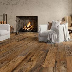 a living room with wood floors and a fire place