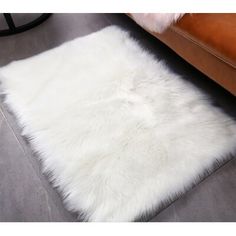 a white sheepskin rug on the floor