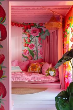 a pink bed with lots of flowers on the wall next to curtains and pillows in a room